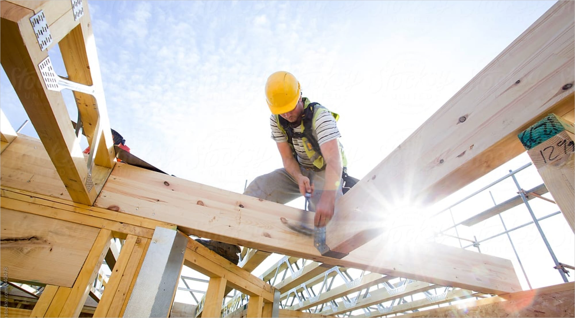 A construction worker using a hammer at a site