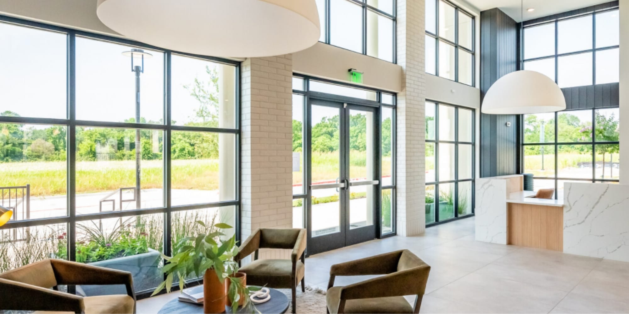 2-story reception space with desk and sitting area