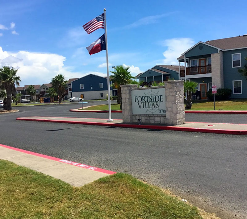 Entry drive to Portside Villas apartment complex